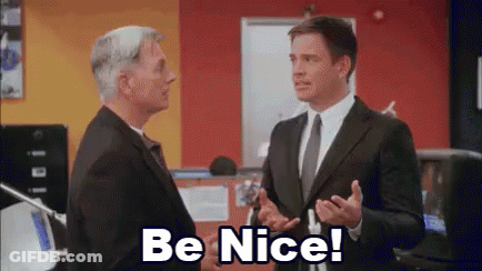 Two Men In Suits Saying Be Nice GIF