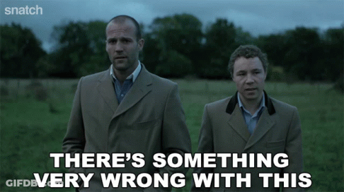 Two Men In Suits Saying Something Very Wrong GIF