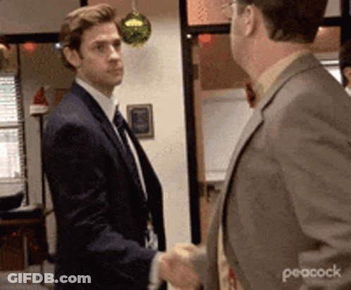 Two Men In Suits Shaking Hands GIF