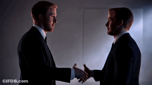 Two Men In Suits Shaking Hands GIF