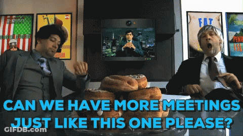 Two Men In Suits Sitting At Table With Donuts Saying Can We Have More Meetings Just Like This One Please GIF