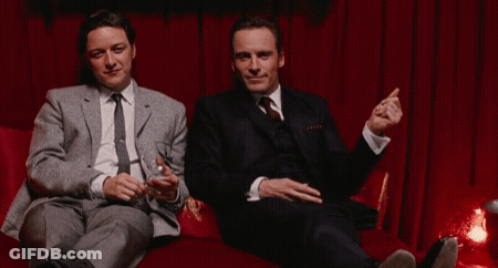 Two Men In Suits Sitting On Couch With Champagne GIF