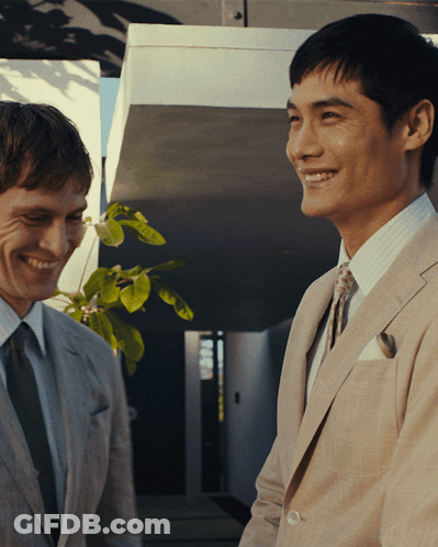 Two Men In Suits Smiling GIF