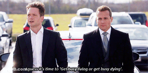 Two Men In Suits Standing Beside Car GIF