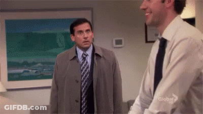 Two Men In Suits Standing In Office GIF