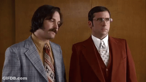 Two Men In Suits Standing Next To Each Other With The Words " I Love Lamp " In Yellow Letters GIF