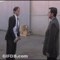 Two Men In Suits Standing Together GIF