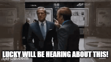 Two Men In Suits Talking In Hallway Lucky Will Be Hearing About This GIF