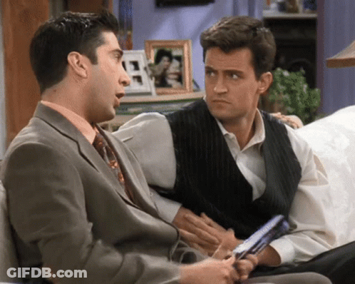 Two Men In Suits Talking GIF