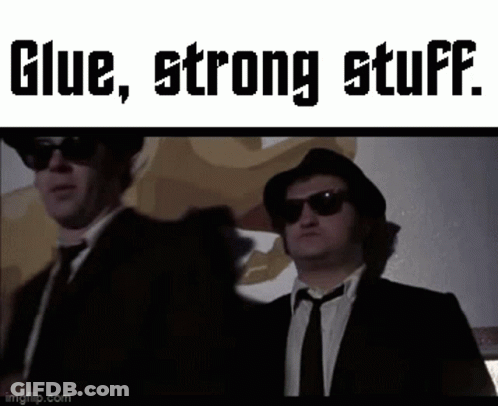 Two Men In Suits With Glue Strong Stuff GIF