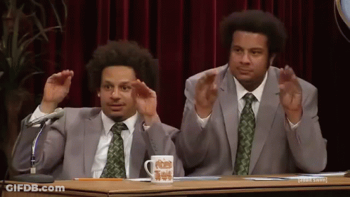 Two Men In Suits With Microphone And Mug GIF