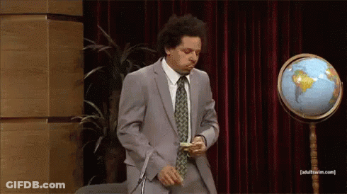 Two Men In Suits With Microphone And Mug GIF