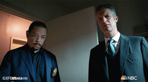 Two Men In Suits With NBC Logo GIF