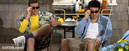 Two Men In Sunglasses At Table GIF