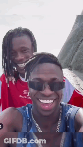 Two Men In Sunglasses Smiling GIF