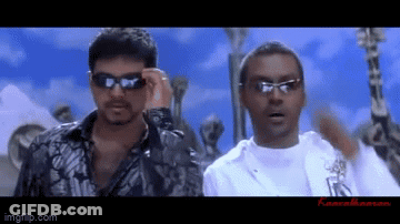 Two Men In Sunglasses Standing Together GIF