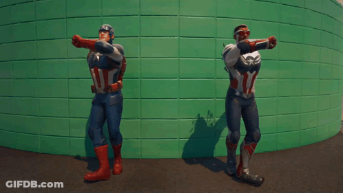 Two Men In Superhero Costumes GIF