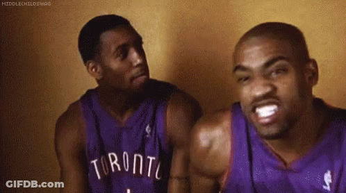 Two Men In Toronto Basketball Jerseys Sitting GIF