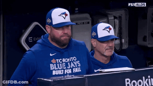 Two Men In Toronto Blue Jays Shirts In Dugout GIF