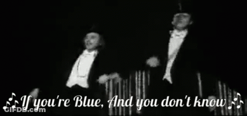 Two Men In Tuxedos And Top Hats On Stage GIF