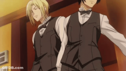 Two Men In Tuxedos Standing Together GIF
