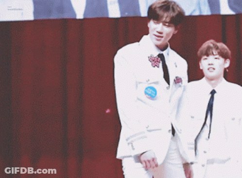 Two Men In White Jackets Holding Hands And Smiling GIF