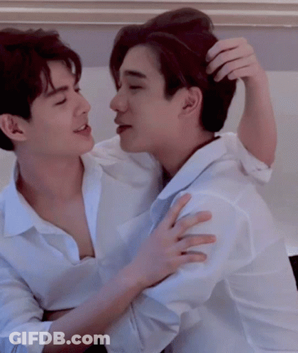 Two Men In White Shirts Hugging And Scratching Hair GIF