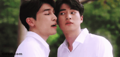 Two Men In White Shirts Kissing On Cheeks GIF