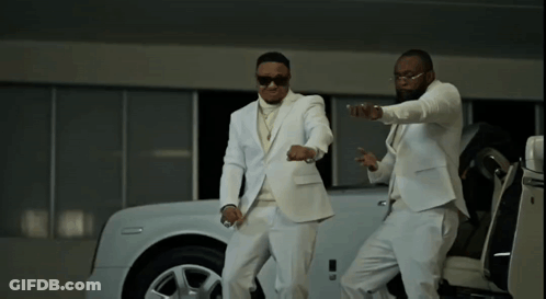 Two Men In White Suits Standing Next To White Car GIF