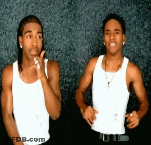 Two Men In White Tank Tops And Black Pants GIF