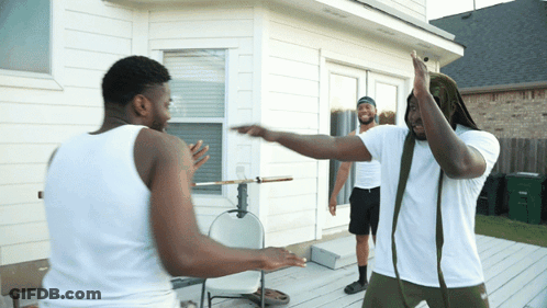 Two Men In White Tank Tops On Deck GIF