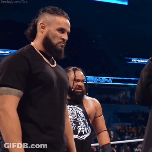 Two Men In Wrestling Ring One With NMX Shirt GIF
