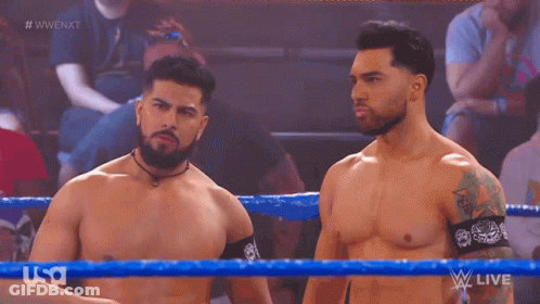 Two Men In Wrestling Ring, One With Tattoo GIF
