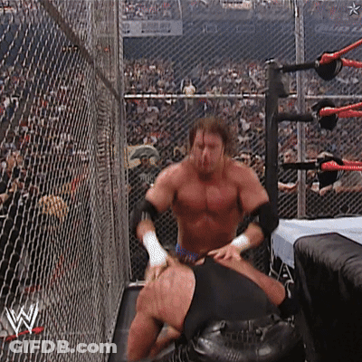 Two Men In Wrestling Ring With Letter W GIF