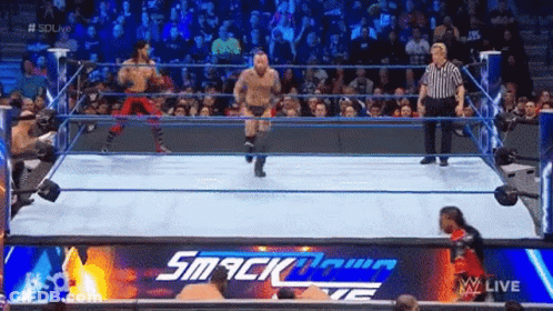 Two Men In Wrestling Ring With Referee GIF