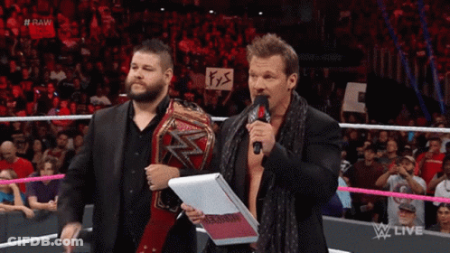 Two Men In Wrestling Ring With Sign #Raw GIF