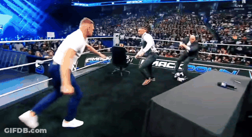 Two Men In Wrestling Ring With Smack GIF