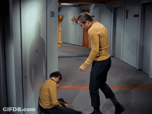 Two Men In Yellow Shirts Standing Together GIF