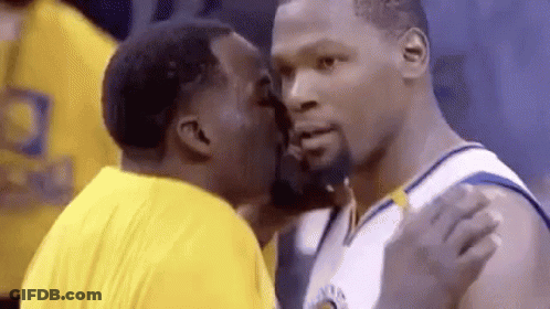 Two Men Kissing During Basketball Game GIF