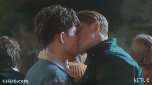Two Men Kissing In Front Of Crowd GIF