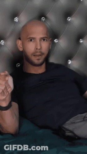 Two Men Kissing In Front Of Line TV Screen GIF