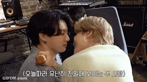Two Men Kissing In Front Of Marshall Amplifier GIF