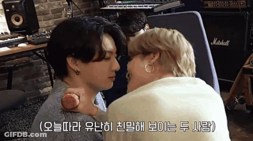 Two Men Kissing In Front Of Marshall Amplifier GIF