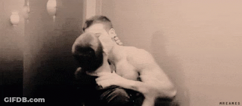 Two Men Kissing In Front Of Mirror GIF