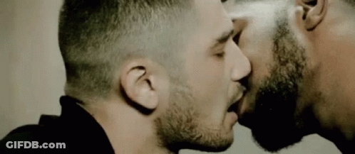 Two Men Kissing In Front Of Mirror GIF