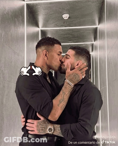 Two Men Kissing In Hallway De Un Commentario De TikTok GIF