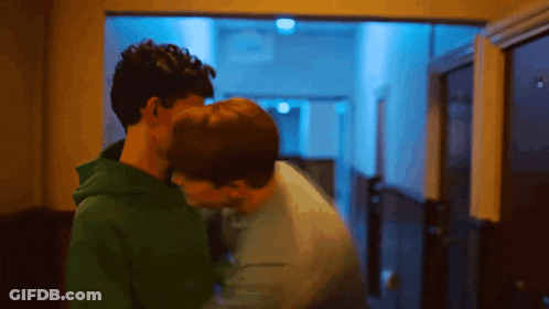 Two Men Kissing In Hallway GIF