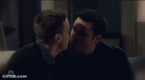 Two Men Kissing On Couch With NBC GIF