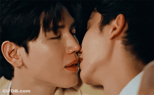 Two Men Kissing On The Cheek GIF