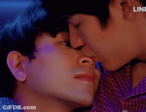 Two Men Kissing With Word Line Behind Them GIF